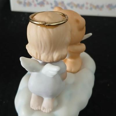 Precious moments figures with a precious moments photo album