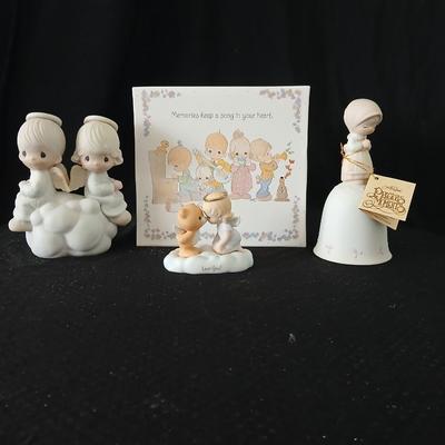 Precious moments figures with a precious moments photo album