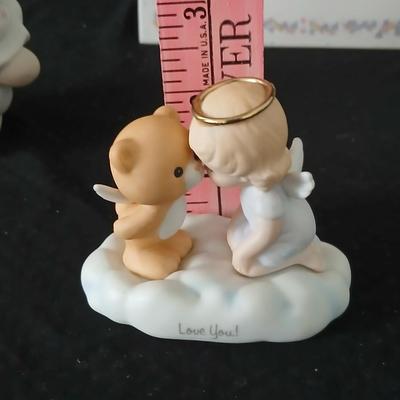 Precious moments figures with a precious moments photo album