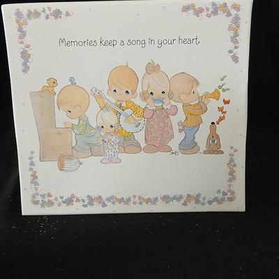 Precious moments figures with a precious moments photo album