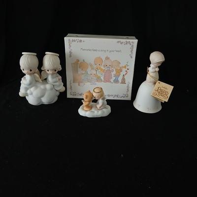 Precious moments figures with a precious moments photo album