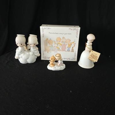 Precious moments figures with a precious moments photo album