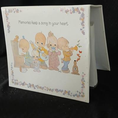 Precious moments figures with a precious moments photo album
