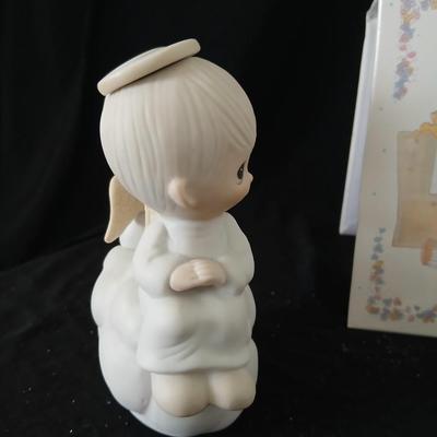 Precious moments figures with a precious moments photo album