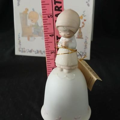 Precious moments figures with a precious moments photo album