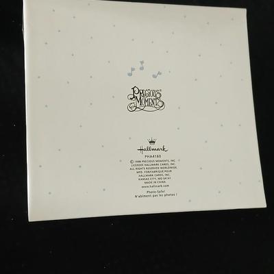 Precious moments figures with a precious moments photo album