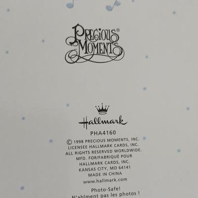 Precious moments figures with a precious moments photo album