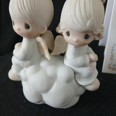 Precious moments figures with a precious moments photo album