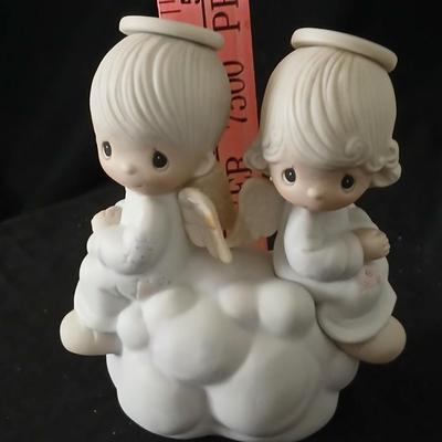 Precious moments figures with a precious moments photo album
