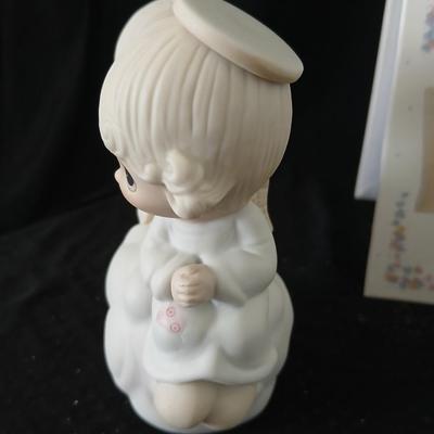Precious moments figures with a precious moments photo album