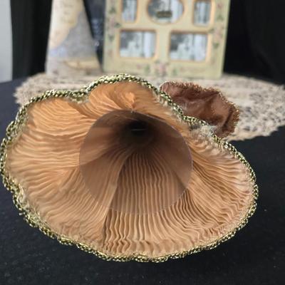 Elegant picture frame with collection of angels, and a large doily