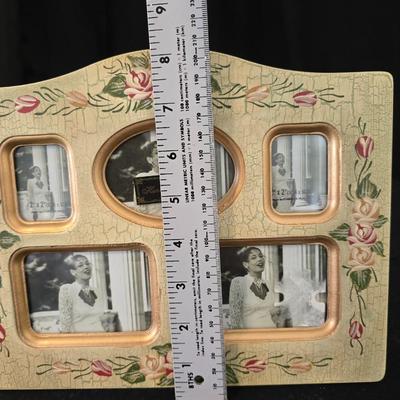 Elegant picture frame with collection of angels, and a large doily