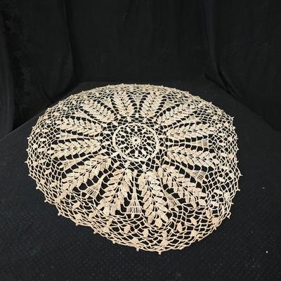 Elegant picture frame with collection of angels, and a large doily