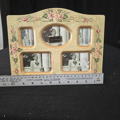 Elegant picture frame with collection of angels, and a large doily