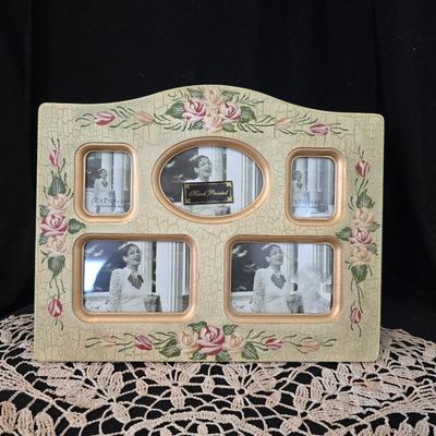 Elegant picture frame with collection of angels, and a large doily