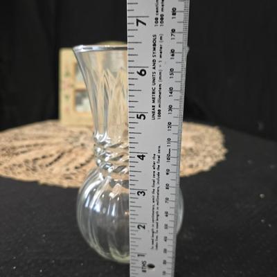 Elegant picture frame with collection of angels, and a large doily