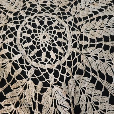 Elegant picture frame with collection of angels, and a large doily