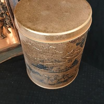 3D wall art plaque by Coppercraft Guild, titled "Traveler's Rest". with two vintage black and bronze / gold lacquer tins