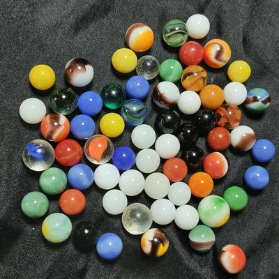 Jar of vintage marbles with a Vintage Halsam lone star double six Dominoes game