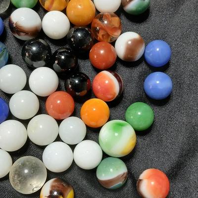 Jar of vintage marbles with a Vintage Halsam lone star double six Dominoes game