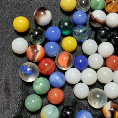 Jar of vintage marbles with a Vintage Halsam lone star double six Dominoes game