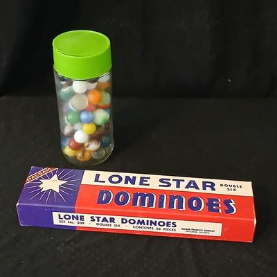 Jar of vintage marbles with a Vintage Halsam lone star double six Dominoes game