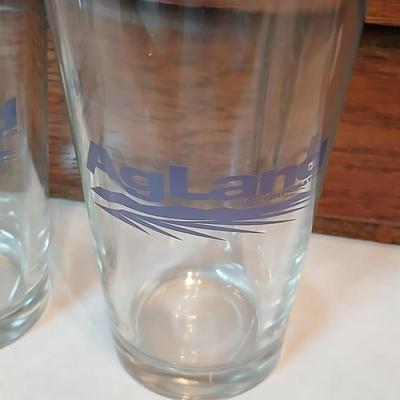 Four Agland drinking glasses and four FA Dairy farmers of America Wendell August handmade pewter coasters