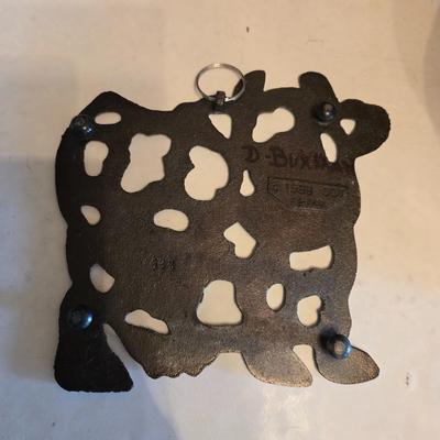 Cow canister - Ceramic cow themed crock - copper-toned cast iron trivet in the shape of a cow - and more