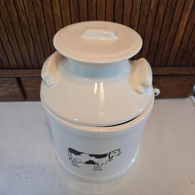 Cow canister - Ceramic cow themed crock - copper-toned cast iron trivet in the shape of a cow - and more