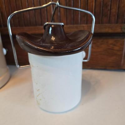 Cow canister - Ceramic cow themed crock - copper-toned cast iron trivet in the shape of a cow - and more