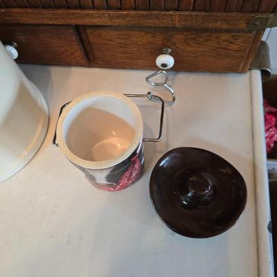 Cow canister - Ceramic cow themed crock - copper-toned cast iron trivet in the shape of a cow - and more