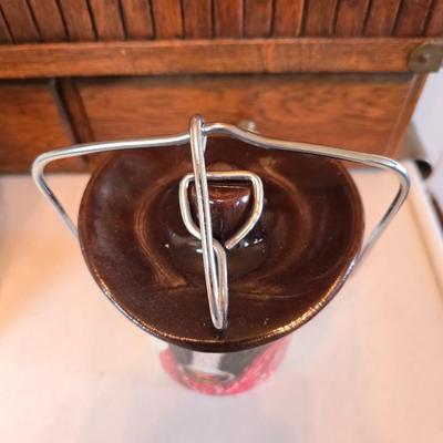 Cow canister - Ceramic cow themed crock - copper-toned cast iron trivet in the shape of a cow - and more