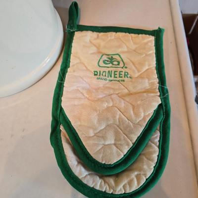 Cow canister - Ceramic cow themed crock - copper-toned cast iron trivet in the shape of a cow - and more