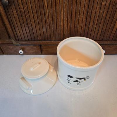 Cow canister - Ceramic cow themed crock - copper-toned cast iron trivet in the shape of a cow - and more
