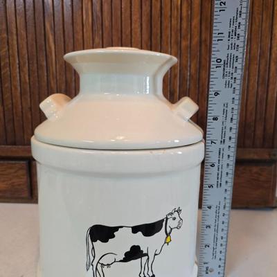 Cow canister - Ceramic cow themed crock - copper-toned cast iron trivet in the shape of a cow - and more