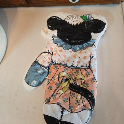 Cow canister - Ceramic cow themed crock - copper-toned cast iron trivet in the shape of a cow - and more