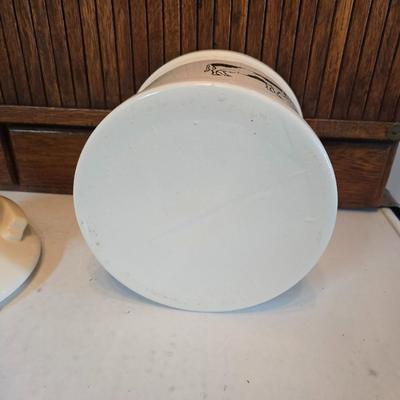 Cow canister - Ceramic cow themed crock - copper-toned cast iron trivet in the shape of a cow - and more