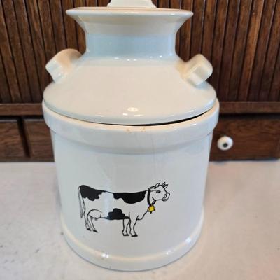 Cow canister - Ceramic cow themed crock - copper-toned cast iron trivet in the shape of a cow - and more
