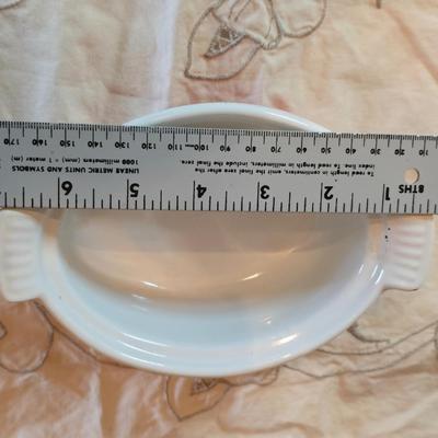 Vintage Le Creuset heritage-style Decoware mini Dutch oven or casserole dish in the signature Flame Orange color.