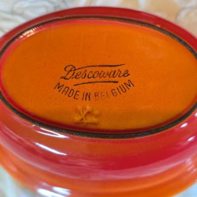 Vintage Le Creuset heritage-style Decoware mini Dutch oven or casserole dish in the signature Flame Orange color.