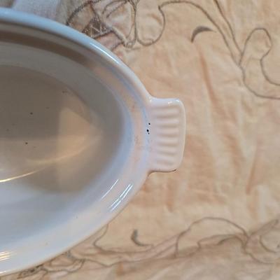 Vintage Le Creuset heritage-style Decoware mini Dutch oven or casserole dish in the signature Flame Orange color.