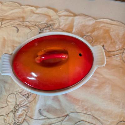 Vintage Le Creuset heritage-style Decoware mini Dutch oven or casserole dish in the signature Flame Orange color.