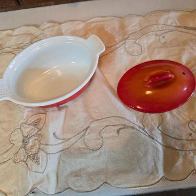 Vintage Le Creuset heritage-style Decoware mini Dutch oven or casserole dish in the signature Flame Orange color.