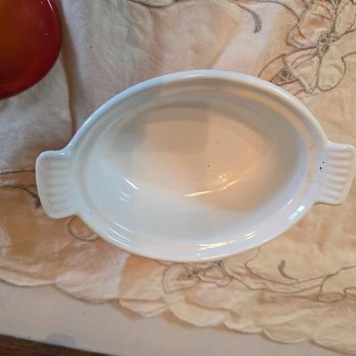 Vintage Le Creuset heritage-style Decoware mini Dutch oven or casserole dish in the signature Flame Orange color.