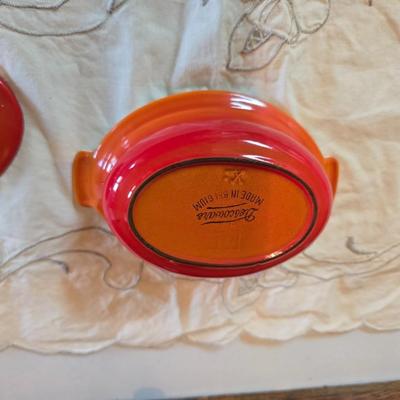 Vintage Le Creuset heritage-style Decoware mini Dutch oven or casserole dish in the signature Flame Orange color.