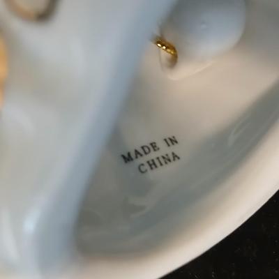 Framed print of the painting "The Hidden Gazebo" by Thomas Kinkade - Two ornate brass picture frames featuring a floral still...