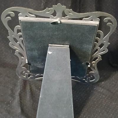 Framed print of the painting "The Hidden Gazebo" by Thomas Kinkade - Two ornate brass picture frames featuring a floral still...