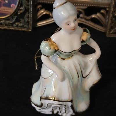 Framed print of the painting "The Hidden Gazebo" by Thomas Kinkade - Two ornate brass picture frames featuring a floral still...