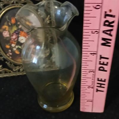 Framed print of the painting "The Hidden Gazebo" by Thomas Kinkade - Two ornate brass picture frames featuring a floral still...