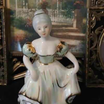 Framed print of the painting "The Hidden Gazebo" by Thomas Kinkade - Two ornate brass picture frames featuring a floral still...